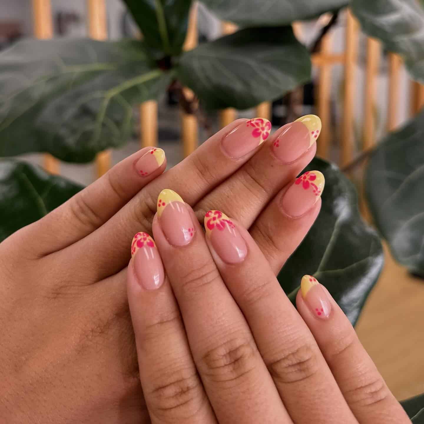 6. Soft Yellow Plumeria French - hawaiian flower nail ideas