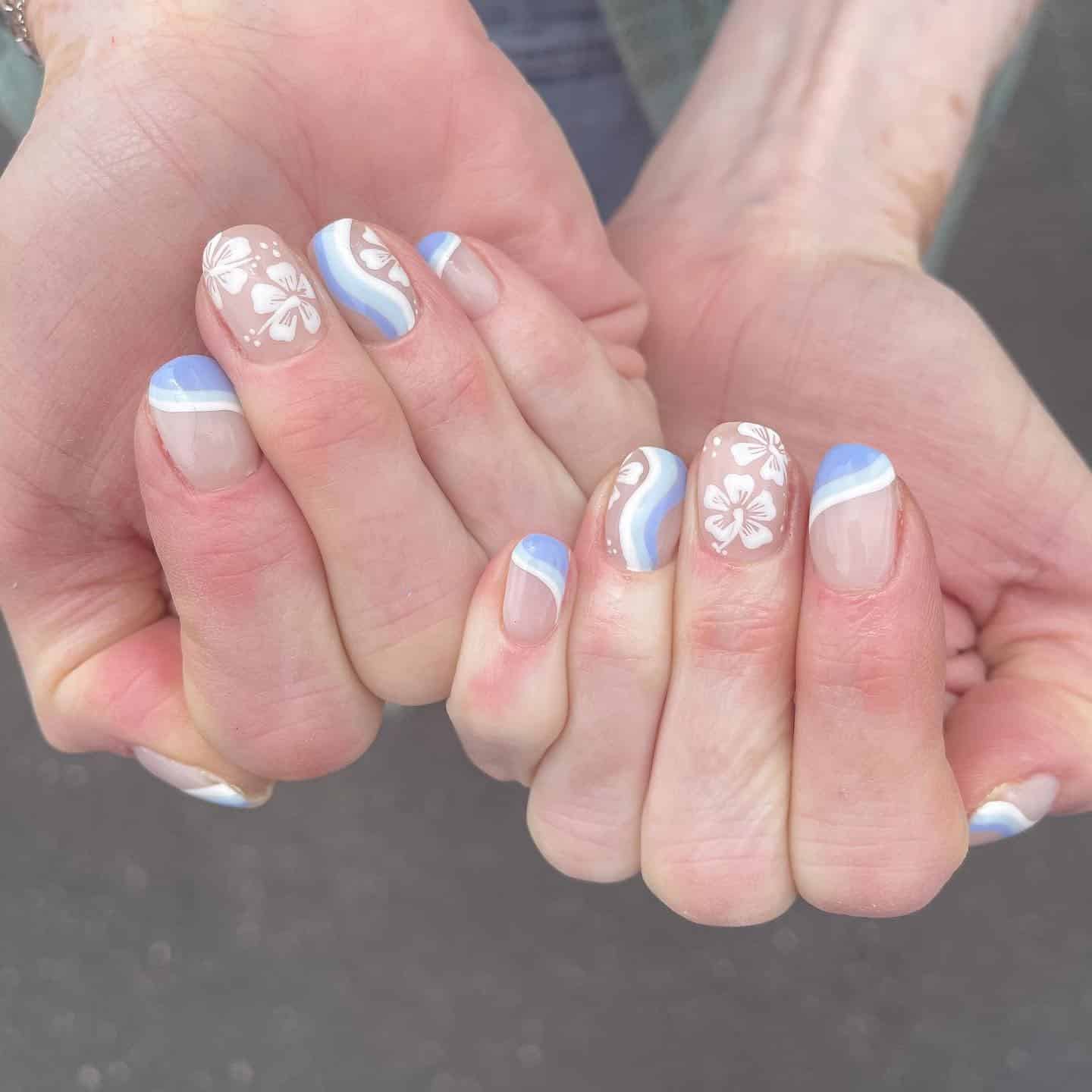 8. Coastal Wave Floral Nails - hawaiian flower nail ideas