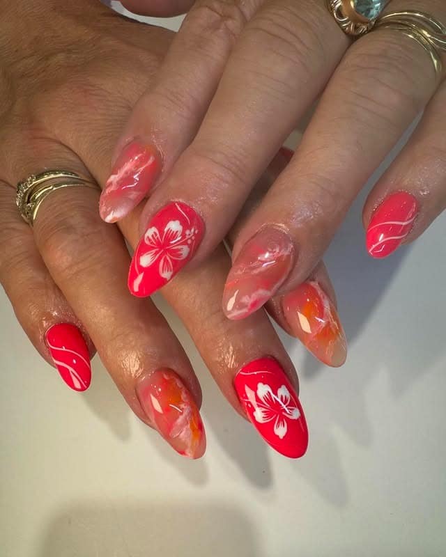 20. Coral Hibiscus Almond Nails - hawaiian flower nail ideas