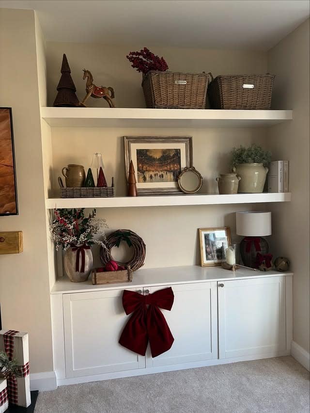 1. Classic White Built-Ins with Holiday Accents - living room shelf ideas