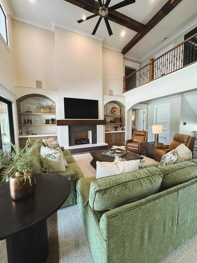 14. Grand Living Room Built-Ins in Beige and Soft Green - living room shelf ideas