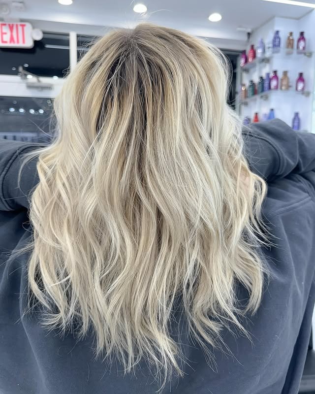 11. Soft Platinum Blonde Balayage with Tousled Waves - Blonde Balayage Hair Color