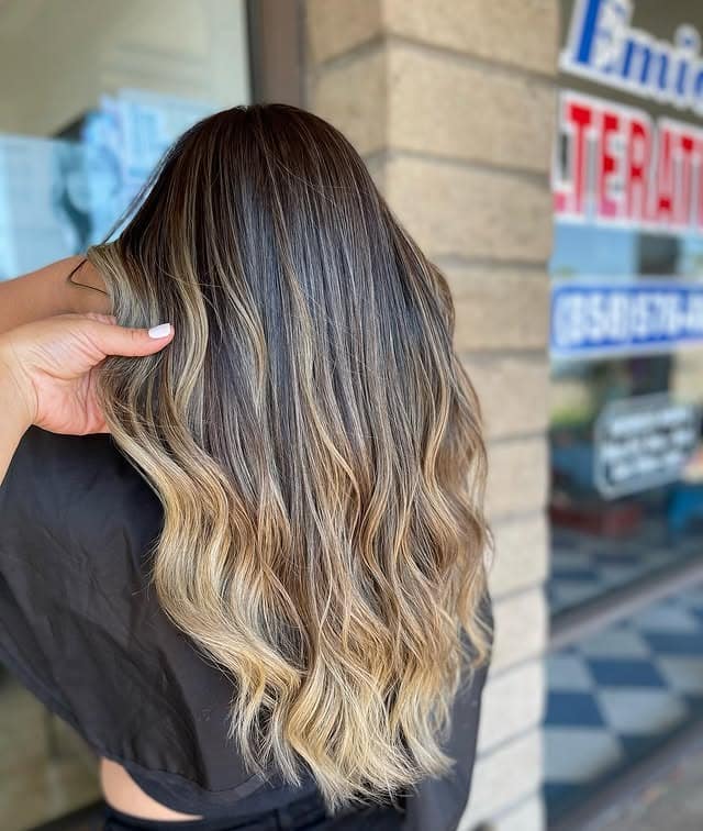 16. Dimensional Blonde Balayage with Natural Waves - Blonde Balayage Hair Color