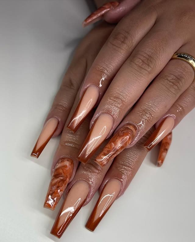 4. Nude Brown Coffin Nails with Marble Detail - light brown nail ideas