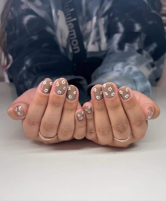 17. Light Brown Nails with White Daisy Details - light brown nail ideas