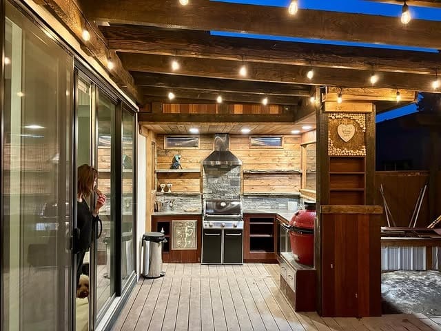 5. Evening Entertaining Kitchen in Walnut and Warm Light - rustic outdoor kitchen ideas