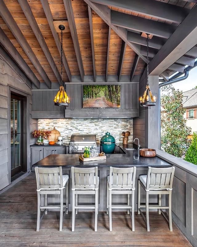 6. Covered Outdoor Bar Kitchen in Weathered Gray and Stone - rustic outdoor kitchen ideas