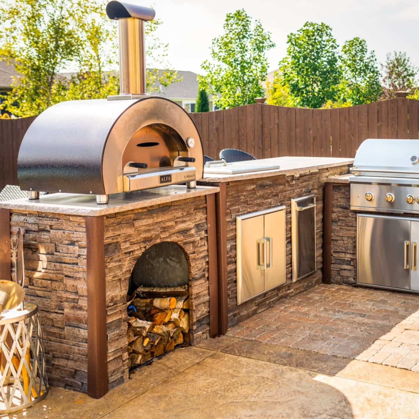11. Stone Pizza Kitchen with Warm Brown and Stainless Steel - rustic outdoor kitchen ideas