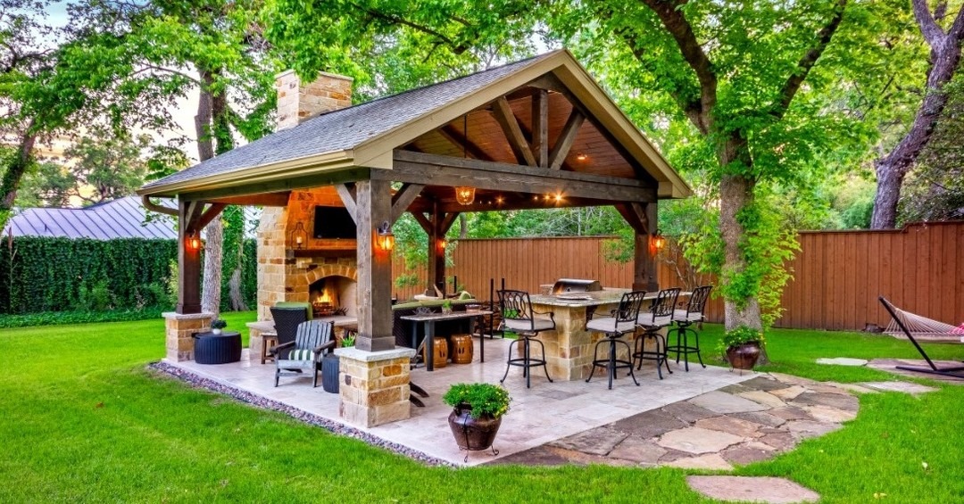 18. Timber Pavilion Kitchen in Natural Wood and Stone Gray - rustic outdoor kitchen ideas