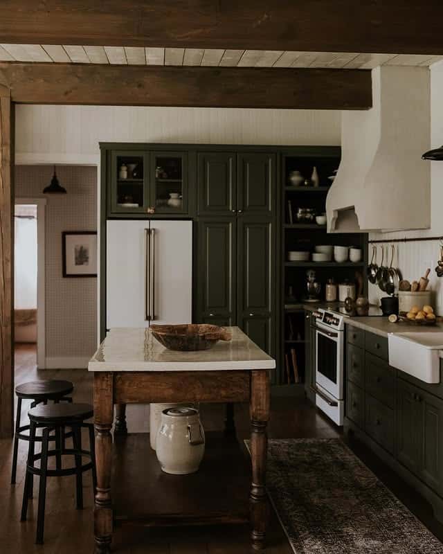 6. Deep Green Farmhouse Kitchen with Rustic Wood - moody kitchen ideas