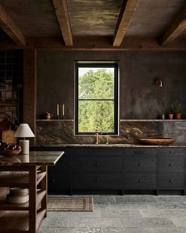 10. Dark Stone Kitchen with Earth-Toned Textures - moody kitchen ideas