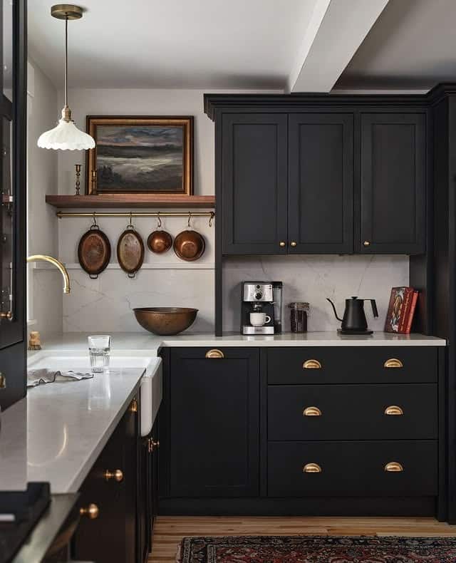 15. Black Traditional Kitchen with Collected Artwork - moody kitchen ideas
