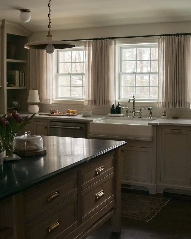 17. Soft Taupe Kitchen with Classic Detailing - moody kitchen ideas