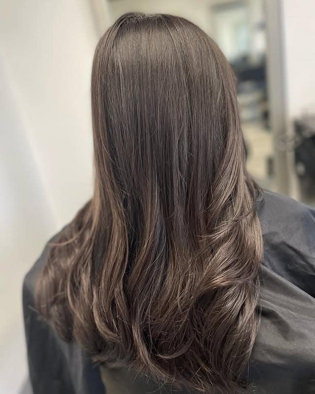 8. Blended Long Layers with Dark Brown Polish - Dark Brown Hair Color