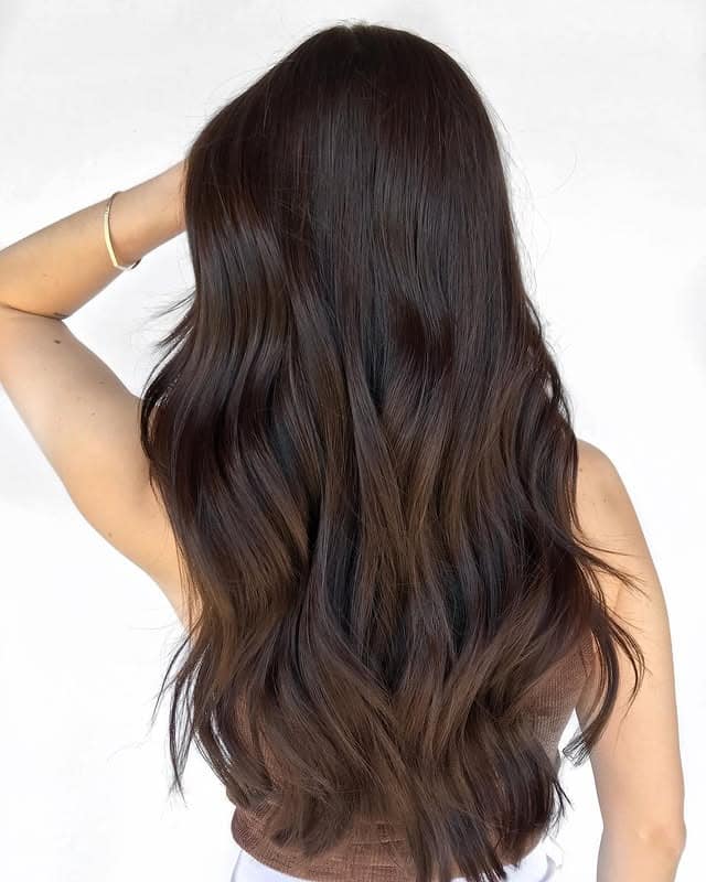 10. Long Natural Waves in Warm Dark Brown - Dark Brown Hair Color