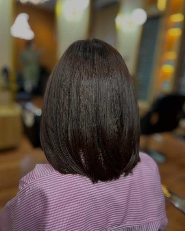 14. Sleek Blunt Bob in Classic Dark Brown - Dark Brown Hair Color