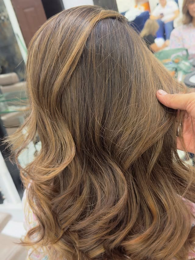 5. Warm Caramel Gloss Waves - Caramel Hair Color