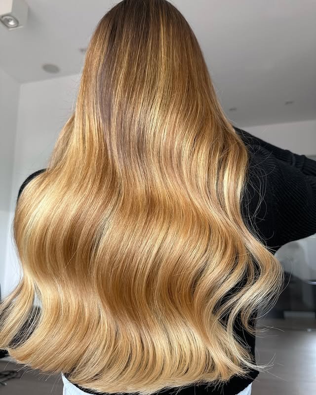 7. Golden Caramel Luxe Lengths - Caramel Hair Color