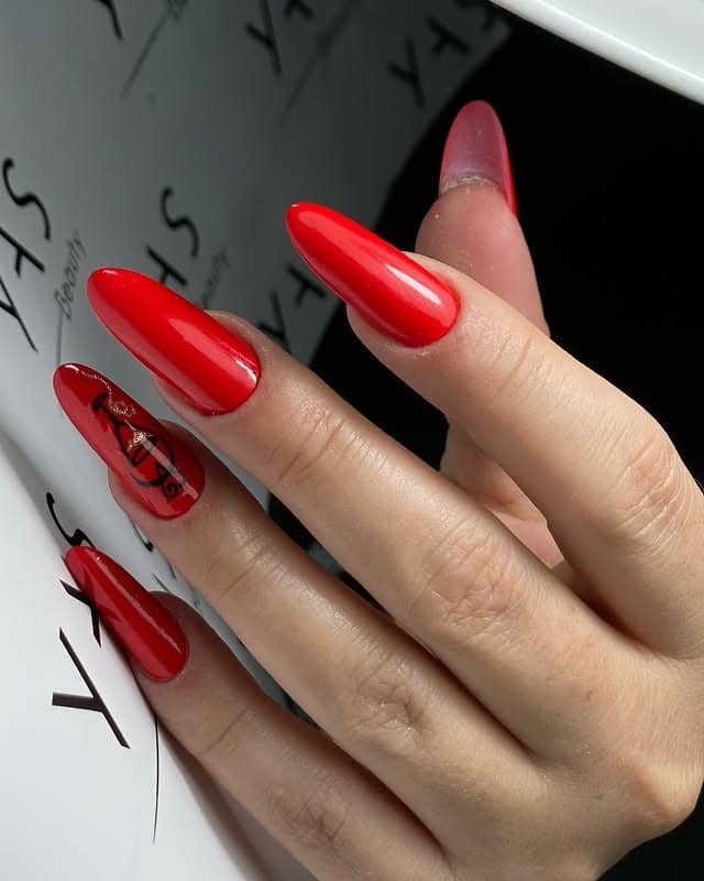 1. Classic Glossy Almond Red - long red nail ideas