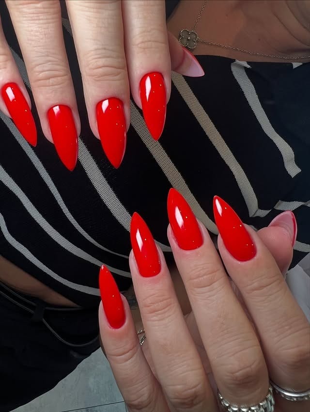 3. Sharp Stiletto True Red Nails - long red nail ideas