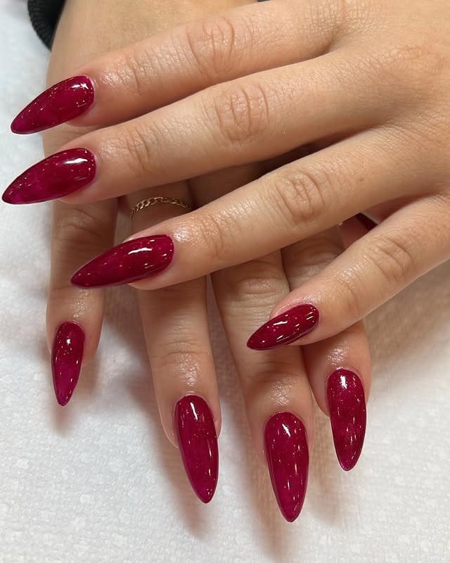 6. Wine Red Glitter Almond Nails - long red nail ideas