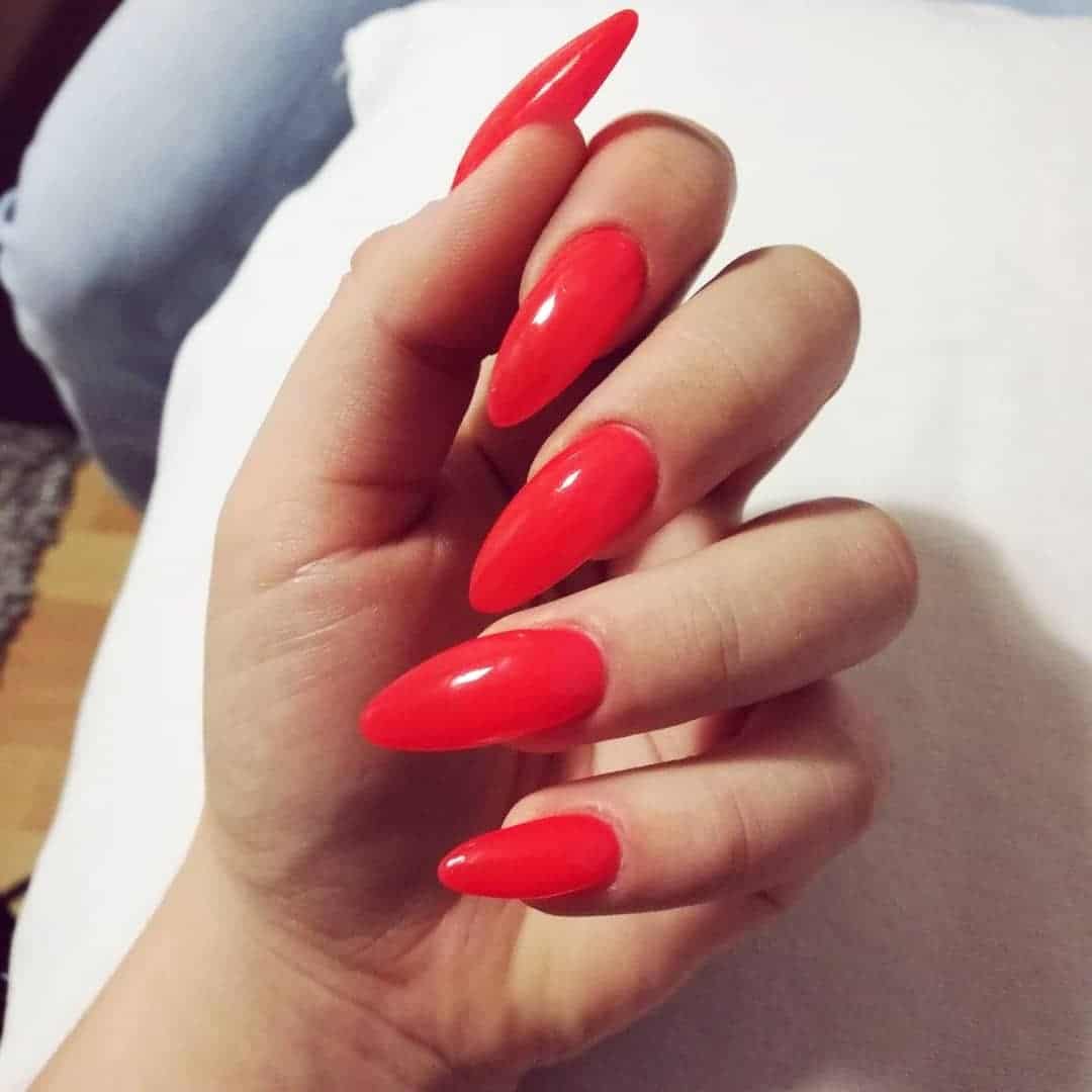 7. Bright Red Oval Nails - long red nail ideas