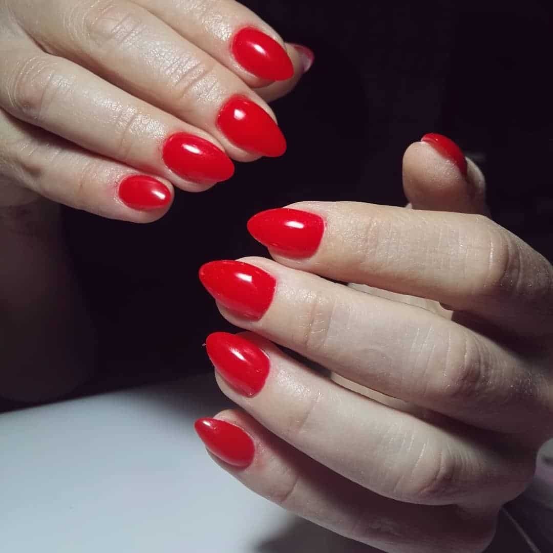 8. Minimal Red Almond Nails - long red nail ideas