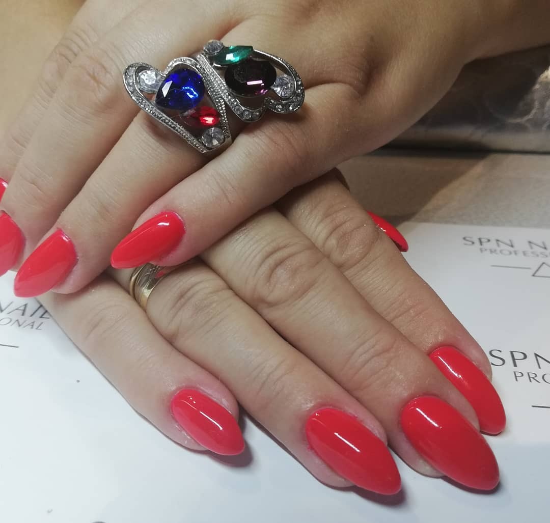 10. Soft Red Almond Nails with High Shine - long red nail ideas