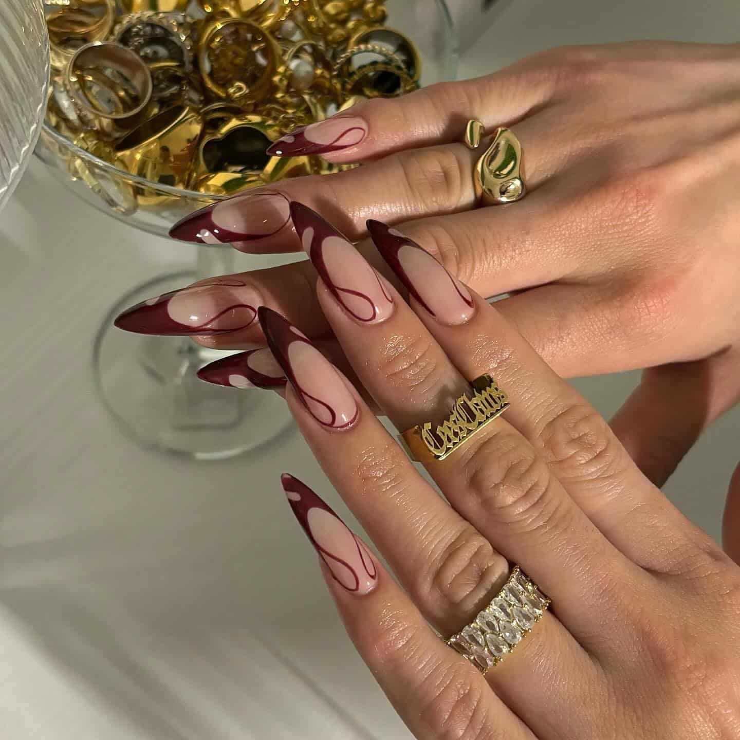 20. Abstract Red French Almond Nails - long red nail ideas