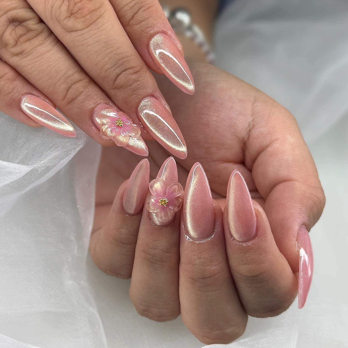 4. Pearlescent Pink Stiletto Nails with 3D Floral Accents - love nail ideas