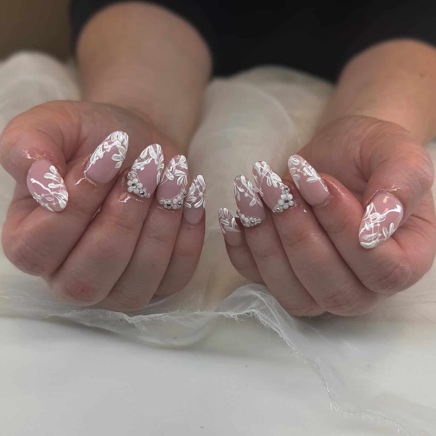 8. Lace-Inspired Almond Nails in Soft Nude with White Detailing - love nail ideas