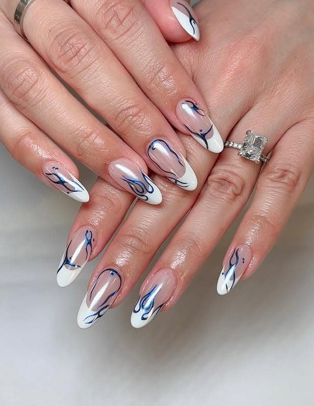 16. Modern French Almond Nails with White and Navy Line Art - love nail ideas