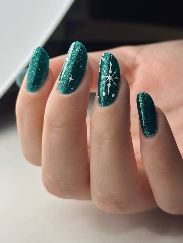 17. Emerald Green Glitter Almond Nails with Star Accents - love nail ideas