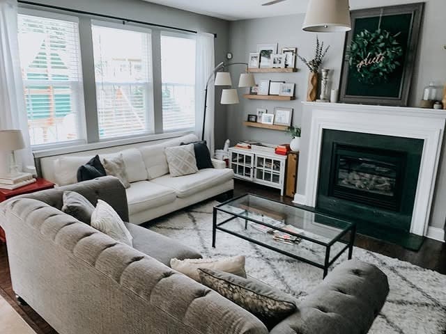 14. Cozy Gray and White Living Room with Fireplace Focus - gray and white living room ideas