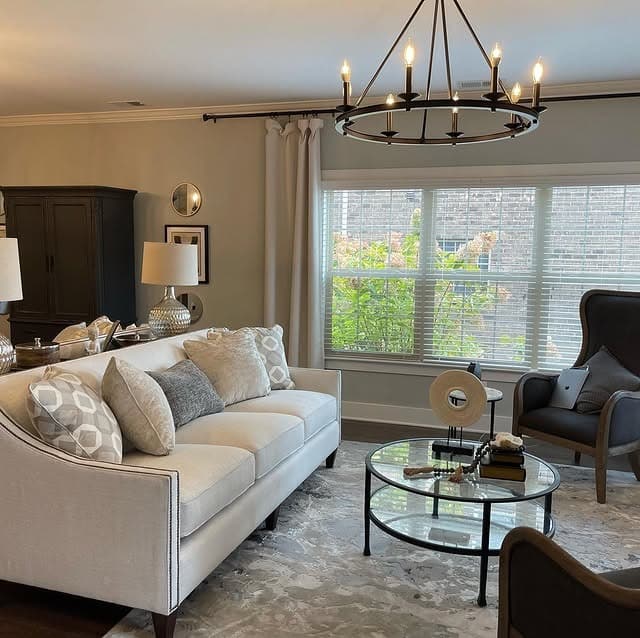 15. Transitional Gray and White Living Room with Soft Lighting - gray and white living room ideas