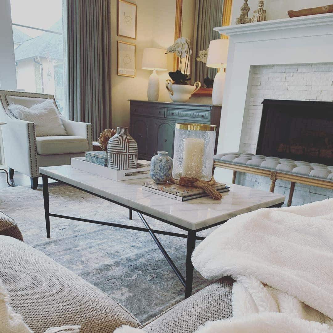 16. Elegant Gray and White Living Room with Marble Accents - gray and white living room ideas