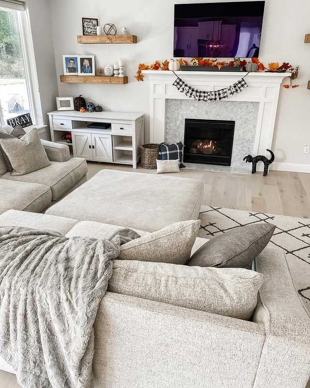 17. Casual Gray and White Living Room with Seasonal Styling - gray and white living room ideas