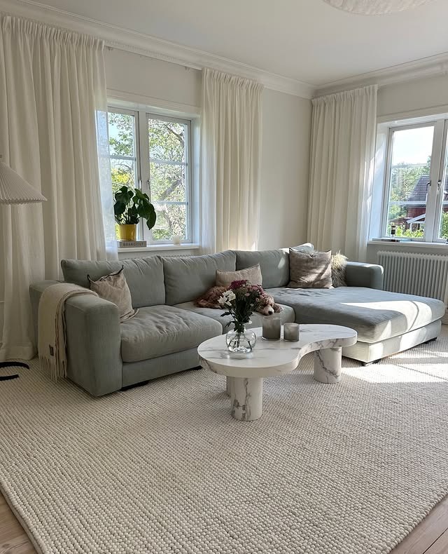 22. Light Gray and White Living Room with Relaxed European Style - gray and white living room ideas