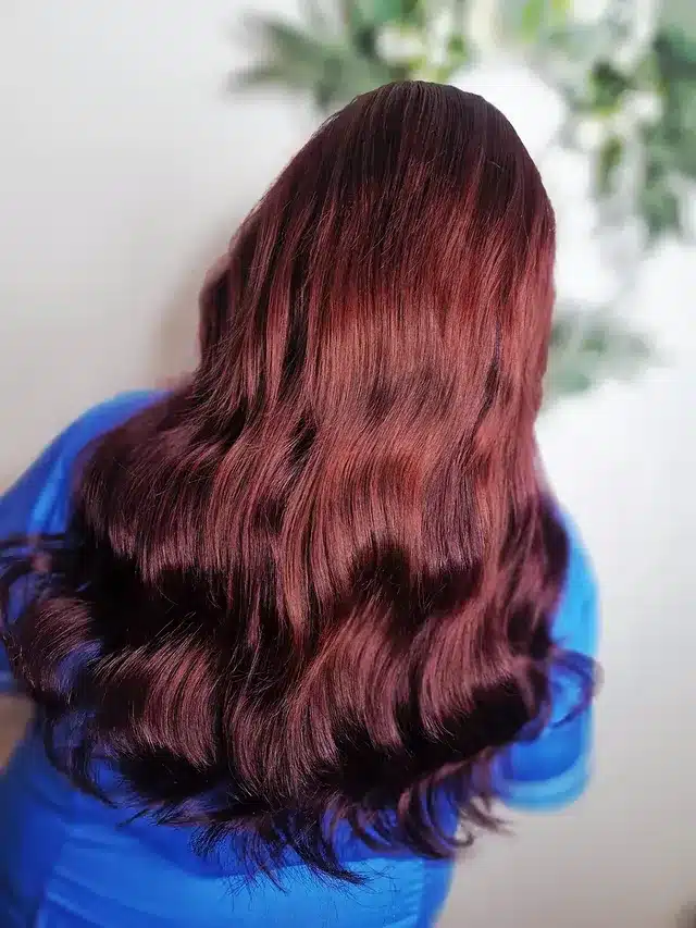 3. Classic Burgundy Waves with Natural Depth - Deep Red Hair Color