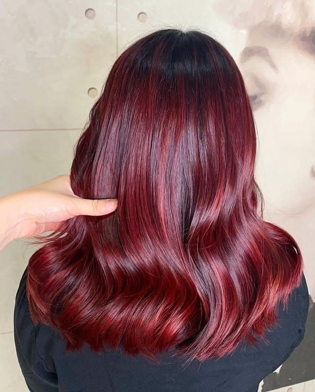 8. Dimensional Garnet Red with Long Layers - Deep Red Hair Color
