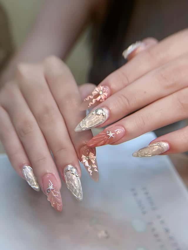 16. Metallic Floral Almonds in Champagne and Blush - luxury nail ideas