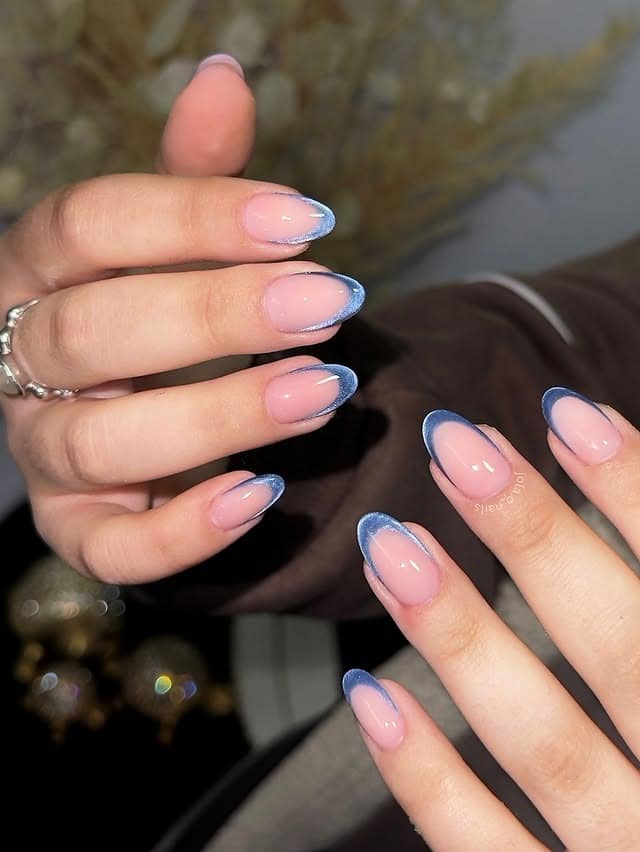 20. Sheer Pink Almonds with Icy Blue Tips - luxury nail ideas