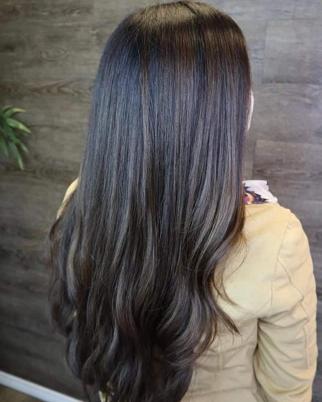 2. Sleek Straight Cut with Ash Brown Accents - Black Hair with Highlights