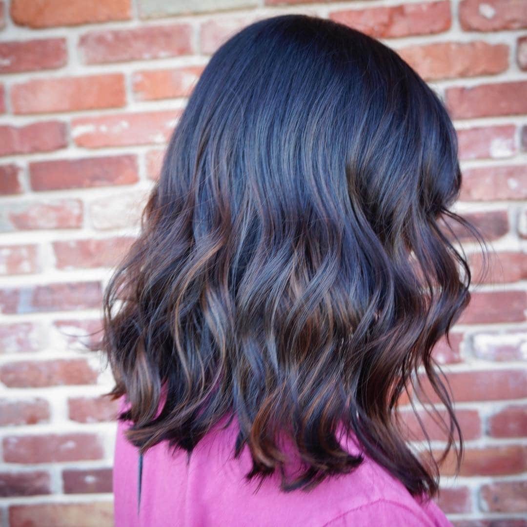 6. Inky Black Waves with Blue-Toned Reflects - Black Hair with Highlights