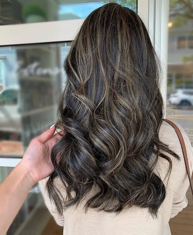 14. Layered Waves with Soft Ash Brown Highlights - Black Hair with Highlights