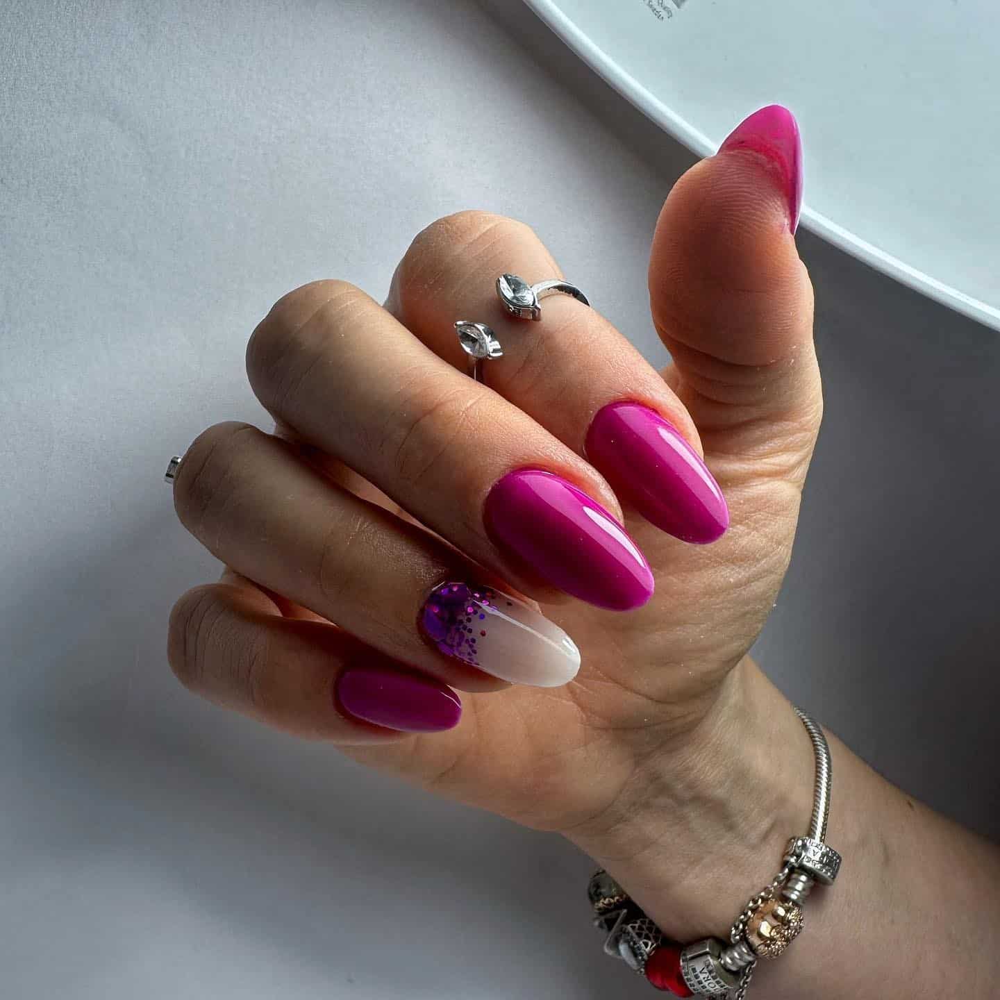 1. Glossy Magenta Almond Elegance - magenta nail ideas