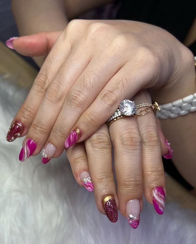 12. Magenta Marble Accent Almond Nails - magenta nail ideas