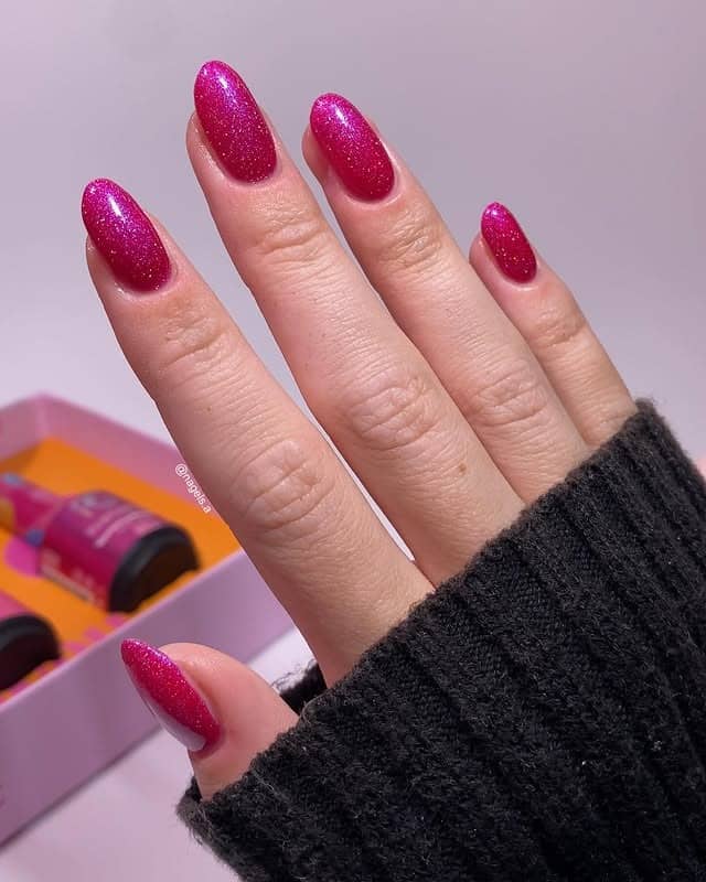 14. Glitter Magenta Almond Statement - magenta nail ideas