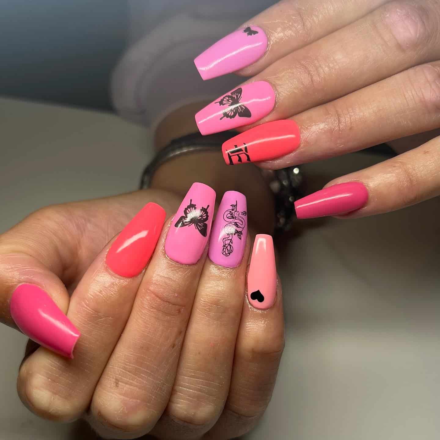 5. Pink Graphic Coffin Nails with Butterfly Art - medium length coffin nail ideas