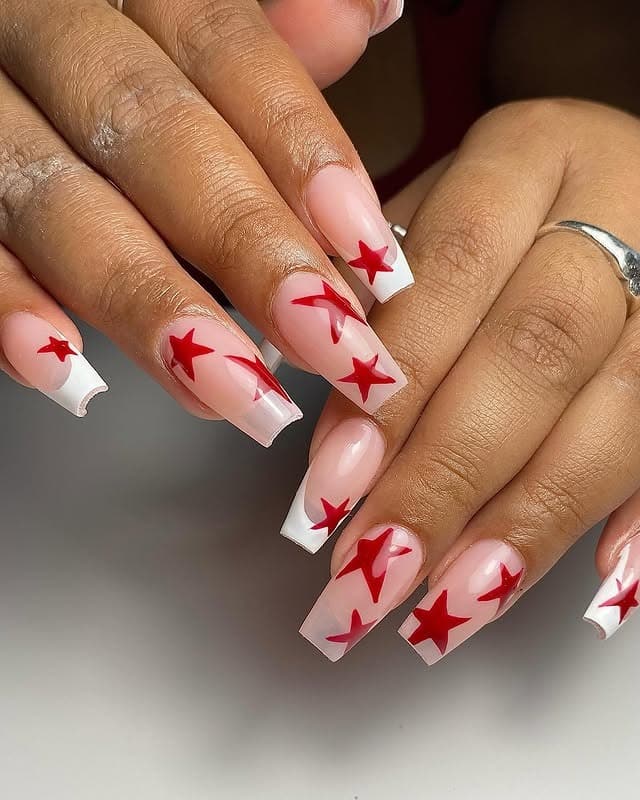 6. Nude Coffin Nails with Red Star Accents - medium length coffin nail ideas